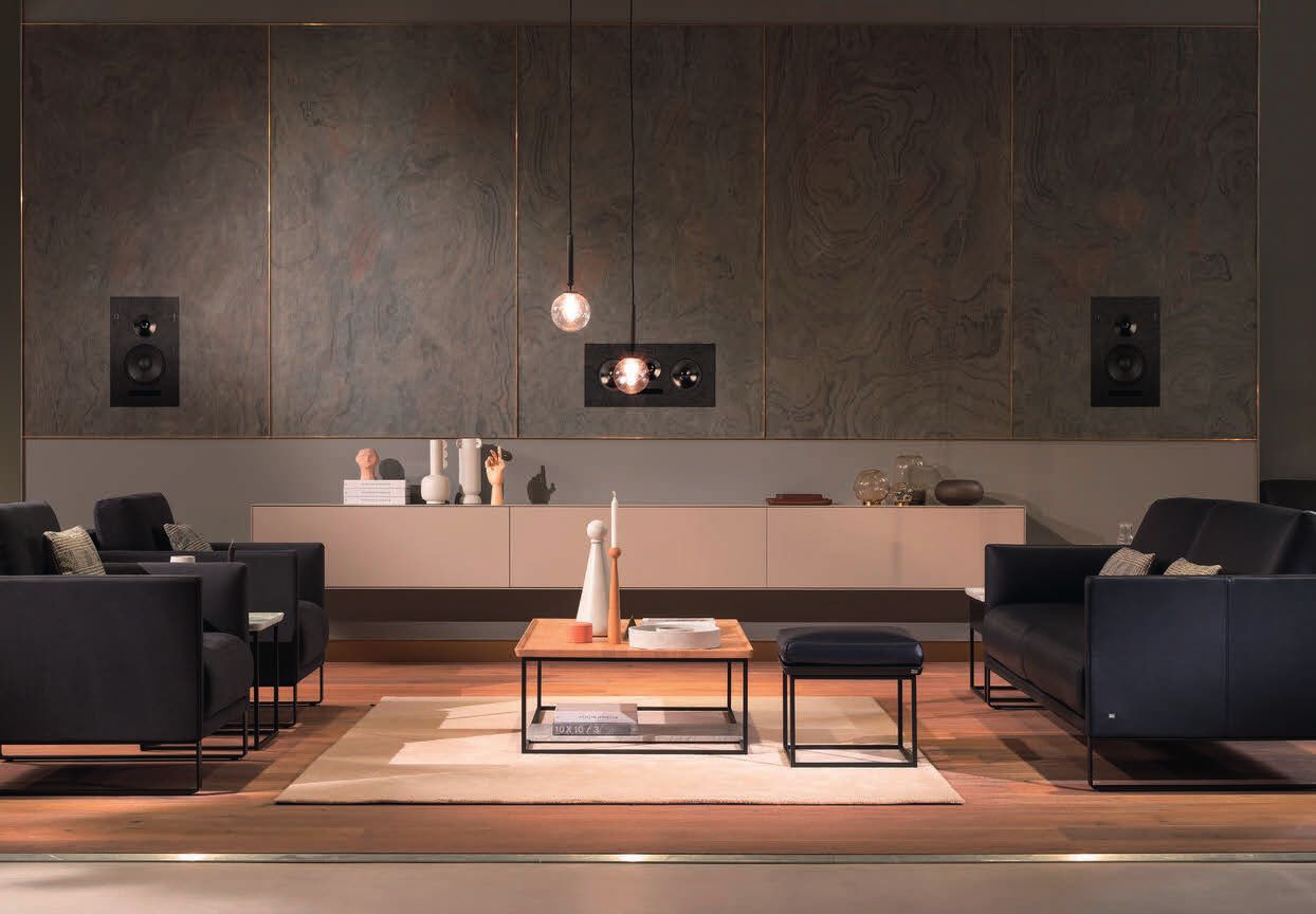 Living room with CM speakers built into the wall on both sides of the screen
