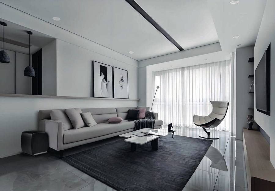 Living room with OE30 speakers recessed in the ceiling beside the downlights